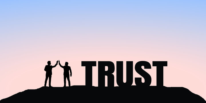 Silhouette of two businessmen standing on top of a hill and "trust" letters on the sides. Business trust concept.