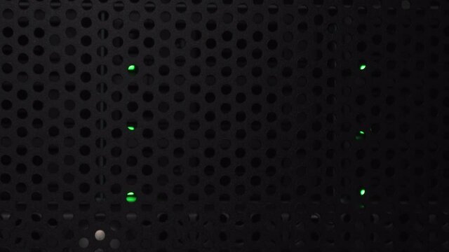 Green Lights Inside A Data Server Cabinet In The Dark Room - Close up