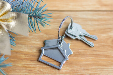 Keychain in the form of a house and keys. Real estate , new year and Christmas concept