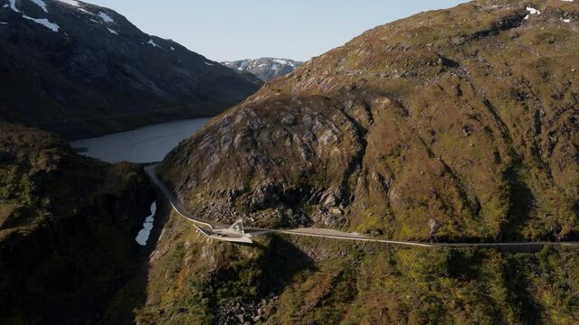 Aerial View, Scenic Norwegian Landscape, Hillside Road and Glacial Lake on Sunny Summer Day. Oldevatnet, Nordfjord Region, Norway, Drone Shot