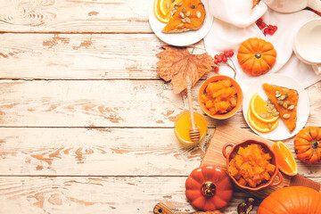 Fototapeta na wymiar Autumn composition with tasty pumpkin jam on wooden background
