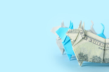 Fototapeta premium Origami bulls as symbol of year 2021 on color background