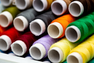 A set of threads in different colors. Multicolored threads for sewing and needlework. Small rolls of thread in a different colours. 