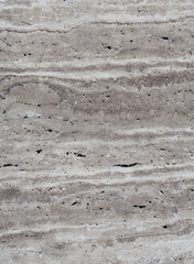 natural granite in beige and brown tones on a white background