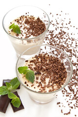 Delicious milk chocolate jelly in transparent glass with chocolate chips