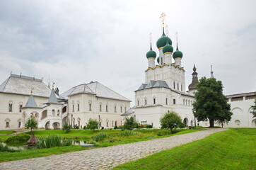 Fototapeta na wymiar Rostov the Great (Veliky), Russia - July 24, 2019: The Church of St. John the theologian and the Red chamber in the Rostov Kremlin. Golden ring of Russia