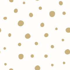 Cute hand drawn gold snow polka dots seamless pattern on white background. Christmas snowflakes. Great for winter fabric, textile, nursery decoration, Christmas wrapping paper, scrapbooking. Surface