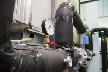 Manometer, pipes and faucet valves of heating system