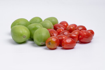 group of green and red cherry tomatoes isolated on white background