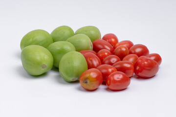 group of green and red cherry tomatoes isolated on white background