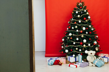 New Year's Home Christmas Tree with gifts decor holiday red background