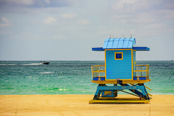 Miami South Beach lifeguard tower and coastline with cloud and blue sky. Miami Beach, Florida.