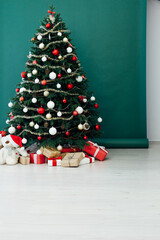 New Year's Home Christmas Tree with gifts decor green background