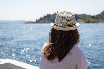 Woman traveler on boat on sea in vacation