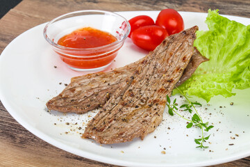 Grilled Thick pork steak served salad