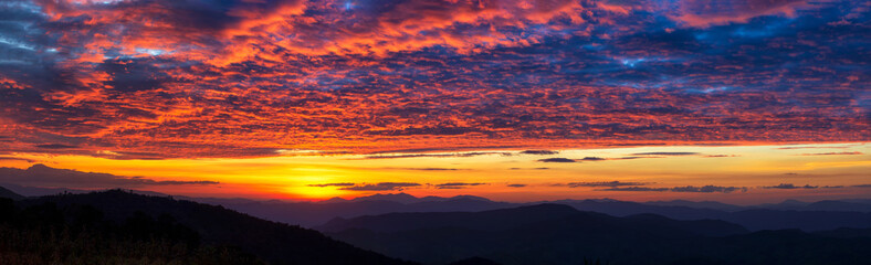 Panorama view of mountain and dramatic twilight sky and beautiful cloud sunset background
