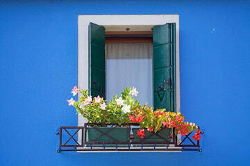 Brightly coloured window at Burano, island in the Venetian Lagoon, Venice, Italy