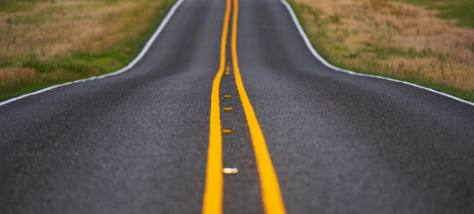 Asphalt texture, way background. Natural american landscape with asphalt road to horizon.