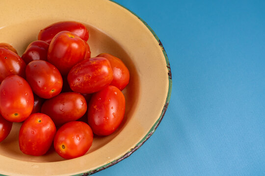 Cherry Tomatoes on rustic plate. close up cherry tomatoes