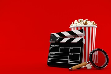 Popcorn and clapboard with magnifying glass