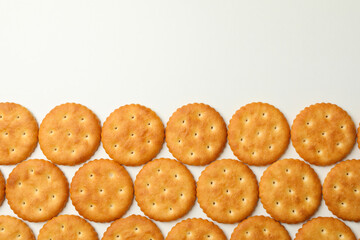 Flat lay with cracker biscuits on white background
