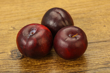 Ripe sweet plum fruit heap