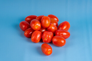 Group of Cherry Tomatoes isolated on blue background