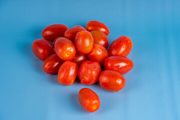Group of Cherry Tomatoes isolated on blue background