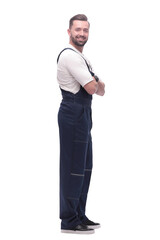 side view. smiling man in overalls looking forward to copy space