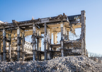 Multi-storey building without walls and bare load-bearing structures, gradually destroyed for...