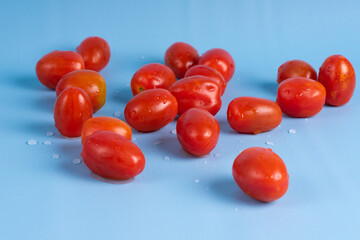 Group of Cherry Tomatoes isolated on blue background