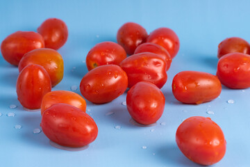 Group of Cherry Tomatoes isolated on blue background
