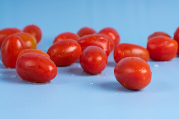 Group of Cherry Tomatoes isolated on blue background