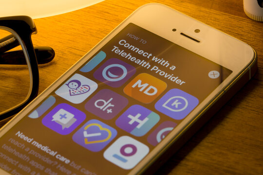 Portland, OR, USA - Apr 15, 2020: Assorted telehealth mobile app icons are seen from the App Store on an iPhone.