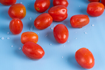 Group of Cherry Tomatoes isolated on blue background