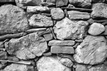 evocative image of black and white texture of ancient wall
