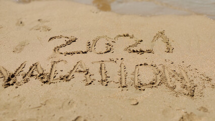 handmade written  VACATION on the sea beach