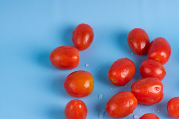 Group of Cherry Tomatoes isolated on blue background