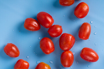Group of Cherry Tomatoes isolated on blue background