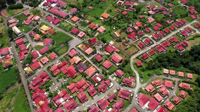 Red roofs Martinique Morne rouge neighborhood aerial shot sunny day tropical island