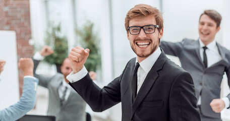 close up. jubilant entrepreneur standing in his office