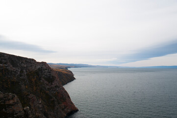 Baikal lake fresh water
flora shore reserve Russia Irkutsk park island Sky clouds clear Olkhon rocks trees embankments sand bay lagoon stones mountains hills horizon line panorama autumn water waves 