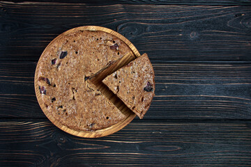 Chocolate charlotte pie on a wooden tray top view