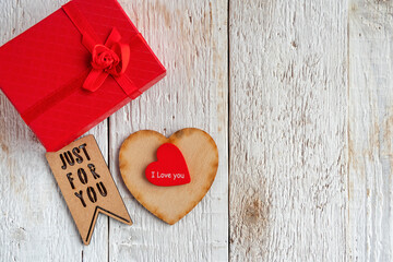 Red and wooden hearts, gift box and text just for you
