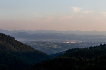 Panorama at sunset from the mountains of the Black Forest near Gersbach over the Wehratal and the city of Wehr towards the Swiss Alps