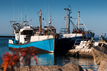 Fishing boats docked at a small harbor on the West Coast of South Africa