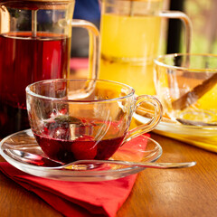 cup of freshly brewed berry tea in a clear cup