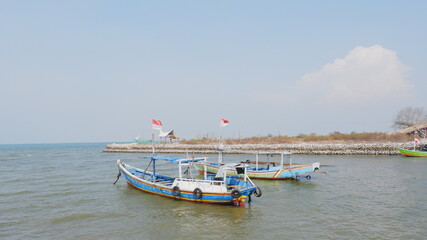 Naklejka na ściany i meble fishing boats on the beach
