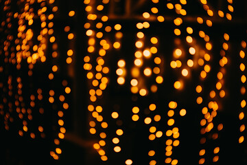 Bokeh lights on dark background. Beautiful festival background.
