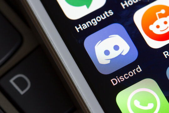 Portland, OR, USA - May 1, 2020: Discord app icon is seen on an iPhone. Discord is a proprietary freeware VoIP application and digital distribution platform designed for video gaming communities.
